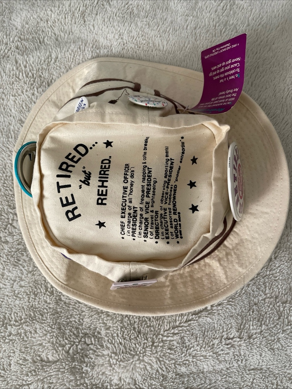 Retired but Rehired Cream hat with Black Print and pins